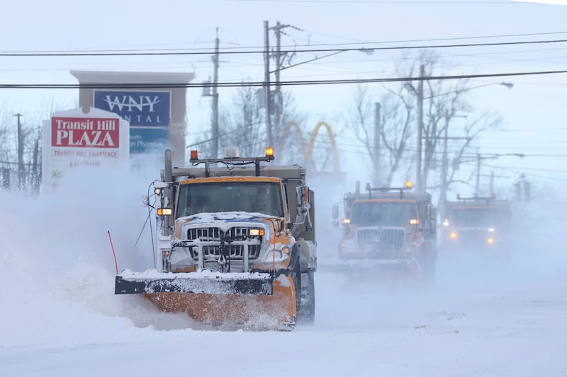 Snow plows clear the roads following a winter storm that hit the Buffalo region in Lancaster, New York, U. S. , December 25, 2022.   REUTERS / Brendan McDermid