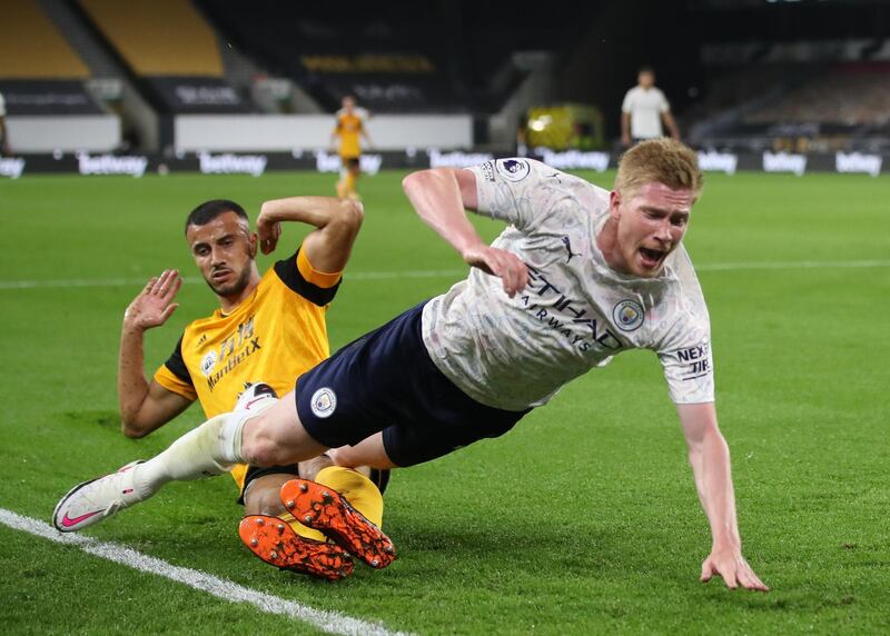 Soccer Football - Premier League - Wolverhampton Wanderers v Manchester City - Molineux Stadium, Wolverhampton, Britain - September 21, 2020 Manchester City's Kevin De Bruyne is fouled in the penalty area by Wolverhampton Wanderers' Romain Saiss and a penalty is awarded Pool via REUTERS/Nick Potts EDITORIAL USE ONLY. No use with unauthorized audio, video, data, fixture lists, club/league logos or 'live' services. Online in-match use limited to 75 images, no video emulation. No use in betting, games or single club/league/player publications.  Please contact your account representative for further details.