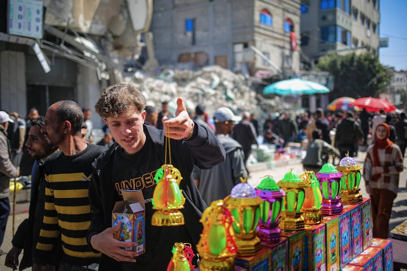 Palestinians shop for Ramadan lanterns in Rafah. AFP