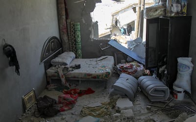 A bedroom damaged during airstrikess by the Syrian regime and their allies is pictured near the town of Saraqeb in Syria's rebel-held northwestern province of Idlib on May 7, 2019.  Air strikes and shelling killed 13 civilians in northwestern Syria today, a monitor said, in the latest escalation to rattle a months-old truce and spark displacement. / AFP / Amer ALHAMWE
