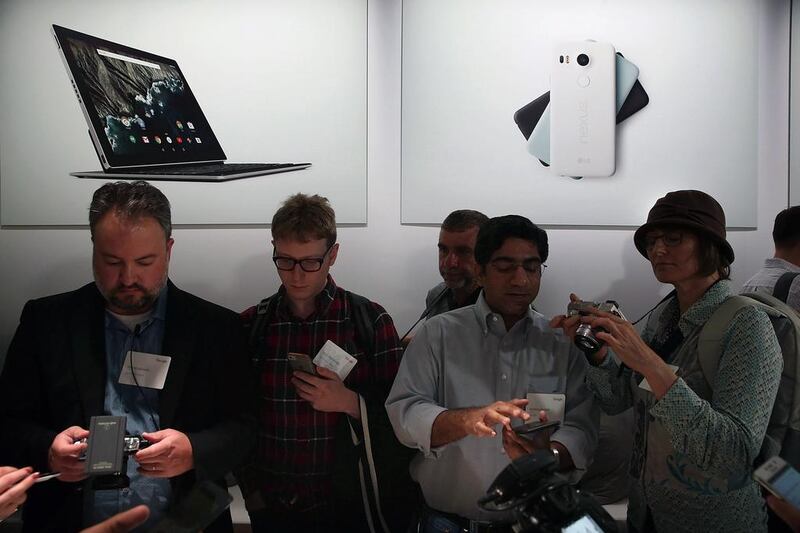 Attendees inspect the new Nexus 5X phone. Justin Sullivan / Getty Images / AFP