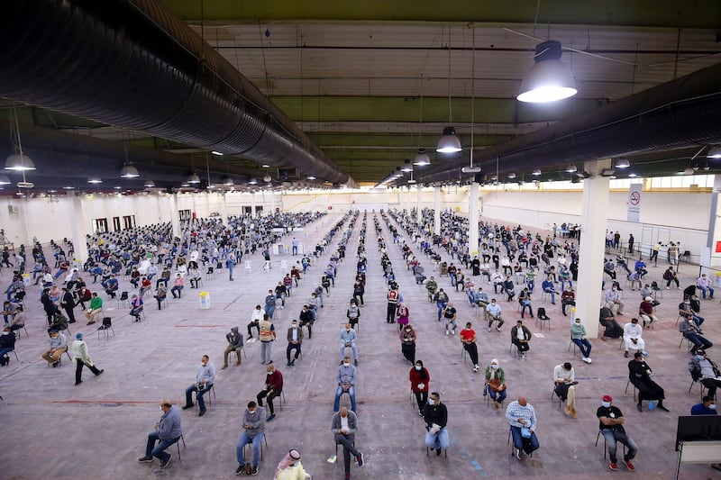 TOPSHOT - Expatriate returning from Egypt, Syria, and Lebanon arrive to be re-tested at a Kuwaiti health ministry containment and screening zone for COVID-19 coronavirus disease in Kuwait City on March 16, 2020. Facing a mounting public health threat, Saudi Arabia, the United Arab Emirates, Kuwait, Bahrain, Qatar and Oman have taken drastic measures to combat the pandemic. Kuwait has taken the strictest measures in the GCC by largely locking down the country over the weekend. / AFP / YASSER AL-ZAYYAT
