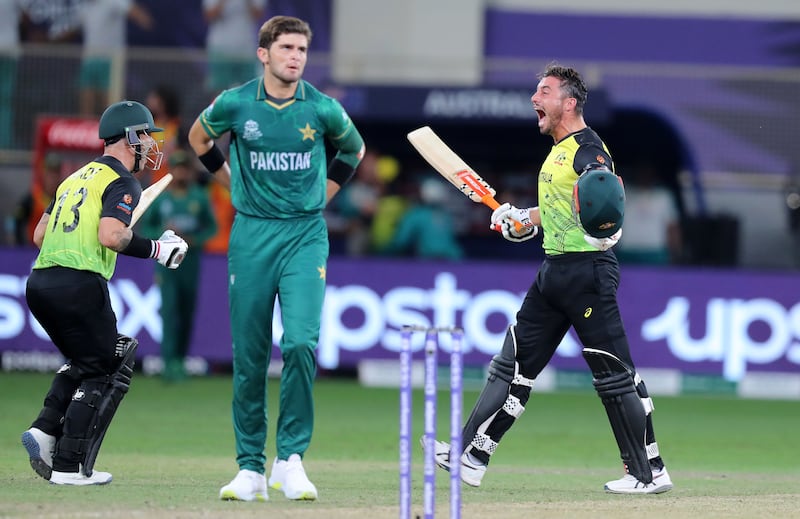 Australia's Marcus Stoinis, right, and Matthew Wade celebrate winning the T20 World Cup semi-final against Pakistan at the Dubai International Cricket Stadium on Thursday, November 11, 2021. All images  Chris Whiteoak / The National