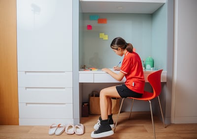 A pupil at the Swiss International Scientific School in Dubai studies in her room after lessons. Photo: Swiss International Scientific School in Dubai
