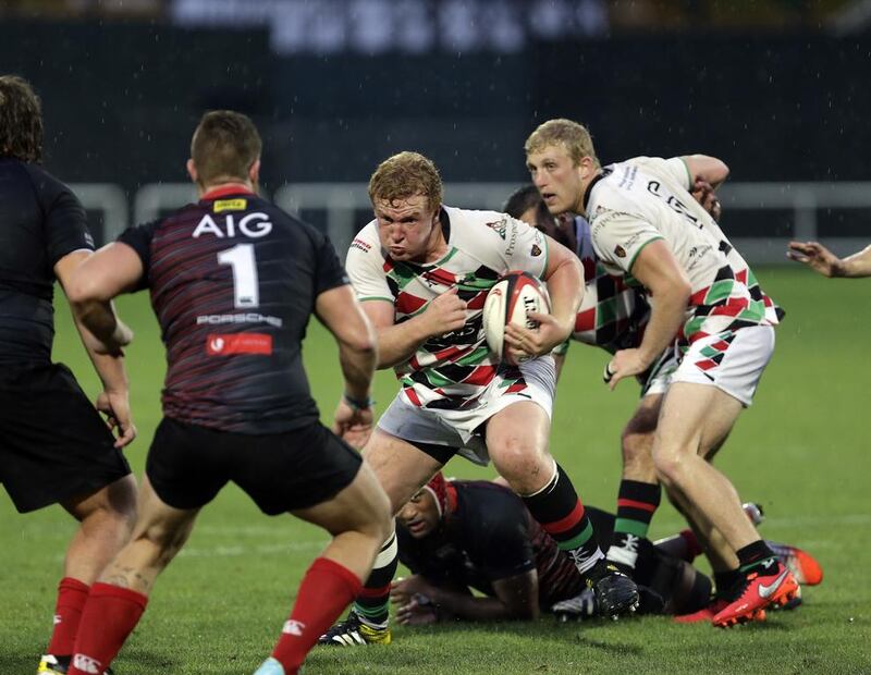 Abu Dhabi Harlequins, in white, up against the Dubai Exiles in the UAE Premiership on April 1, 2016. Jeffrey E Biteng / The National