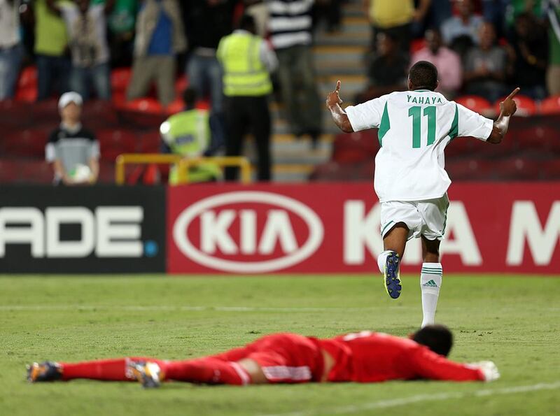 Nigeria's Musa Yahaya, right, celebrates one of their three goals against Mexico, the first coming off an own goal, as the Golden Eaglets won the Fifa Under 17 World Cup title match at  at Mohammed Bin Zayed Stadium in Abu Dhabi on Friday. Sammy Dallal / The National