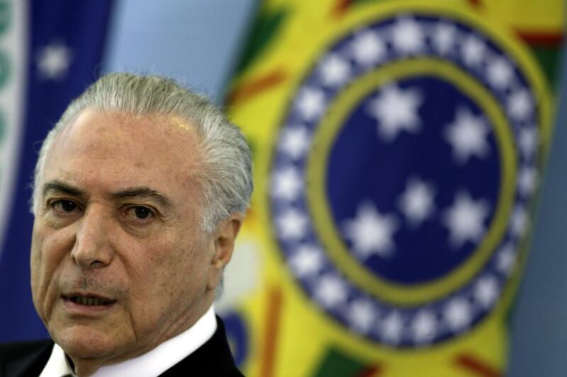 epa06697310 Brazilian President Michel Temer speaks at a press conference at the Planalto Palace, in Brasilia, Brazil, 27 April 2018. Temer defended members of his family after reports about alleged corruption scandals concerning real estate deals.  EPA/JOEDSON ALVES