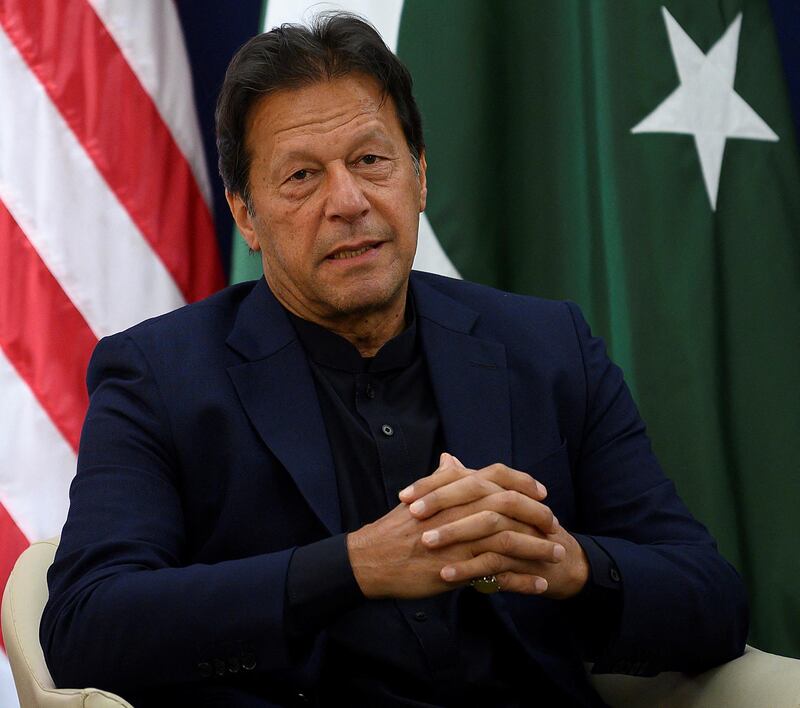 Pakistani Prime Minister Imran Khan speaks with US President ahead of their meeting at the World Economic Forum in Davos, on January 21, 2020. (Photo by JIM WATSON / AFP)