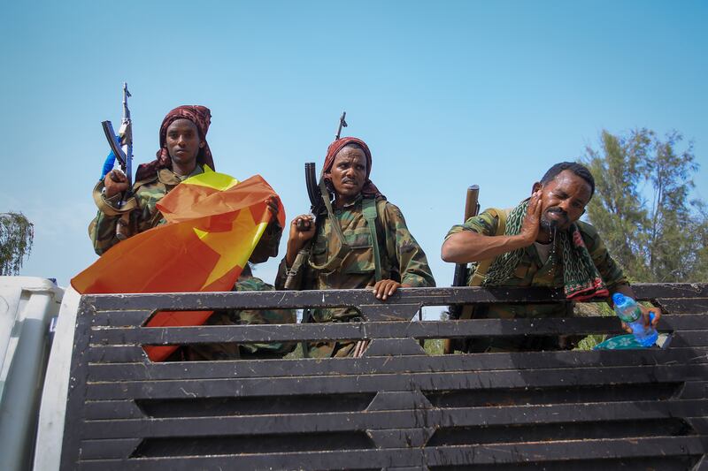 Tigrayan fighters ride in a lorry after taking control of Mekele, capital of Ethiopia's northern Tigray region, from government forces. AP