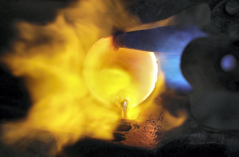 SHARJAH , UNITED ARAB EMIRATES , OCT 24   – 2017 :- One of the worker melting raw silver for making the jewellery at the Al Baroon silver shop in the Al Mareija area near the Heritage area in Sharjah. They are in the jewellery business for the last 30 years. (Pawan Singh / The National) For Weekend