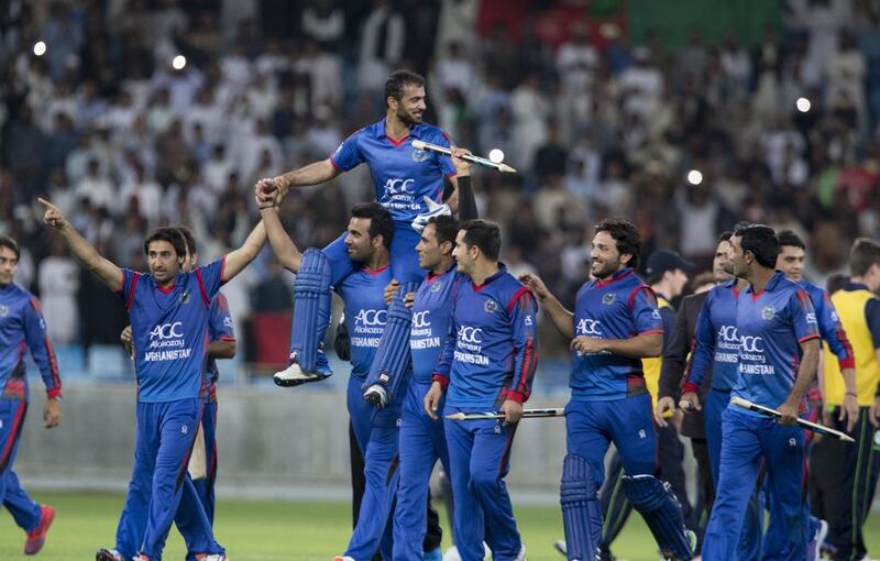 Nowroz Mangal is carried off the field by his teammates after Afghanistan won the inaugural Desert T20 title. Ruel Pableo / The National