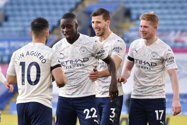 Soccer Football - Premier League - Leicester City v Manchester City - King Power Stadium, Leicester, Britain - April 3, 2021 Manchester City's Benjamin Mendy celebrates scoring their first goal with Sergio Aguero, Ruben Dias and Kevin De Bruyne Pool via REUTERS/Rui Vieira EDITORIAL USE ONLY. No use with unauthorized audio, video, data, fixture lists, club/league logos or 'live' services. Online in-match use limited to 75 images, no video emulation. No use in betting, games or single club /league/player publications. Please contact your account representative for further details.