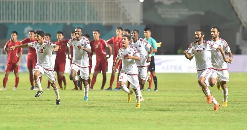 UAE players run to celebrate after winning the penalty shootout against North Korea in the Asian Games quarter-finals. Courtesy UAE FA