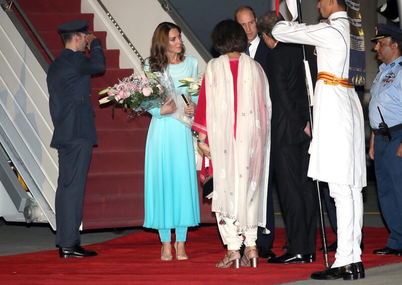 The duchess was handed flowers as she arrived in Pakistan. Getty Images