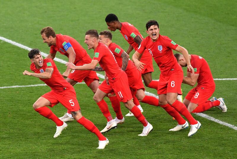 England players sprint towards Eric Dier to celebrate the victory. Laurence Griffiths / Getty Images