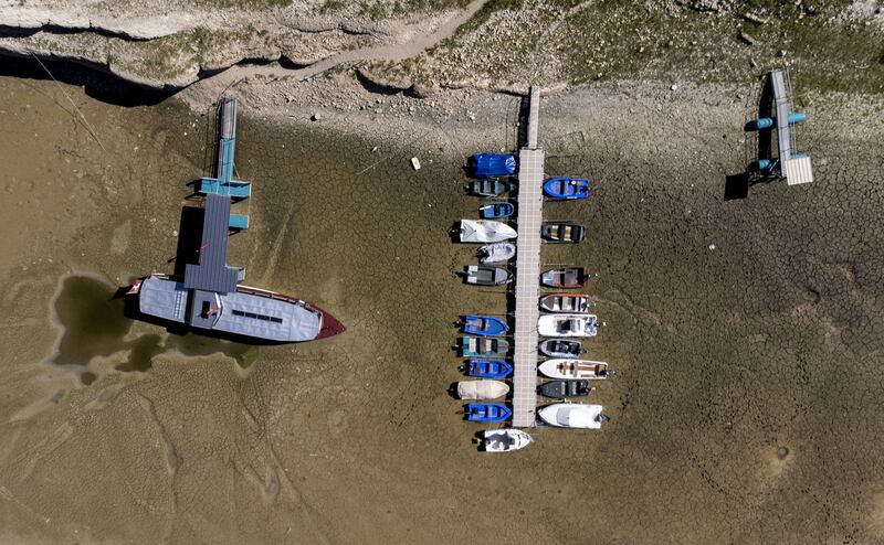 Boats are stuck in the dried-up bed of the drought-hit Doubs river on the border with France in Les Brenets, Switzerland. Reuters