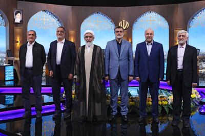 Amirhossein Ghazizadeh Hashemi, third from right, stands with fellow presidential candidates, from left, Masoud Pezeshkian, Alireza Zakani, Mostafa Pourmohammadi, Mohammad Bagher Qalibaf and Saeed Jalili after a televised presidential debate on Tuesday. AP Photo