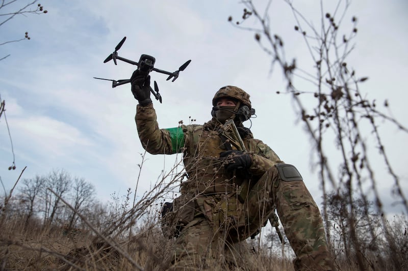 A Ukrainian serviceman practises using a drone. Reuters