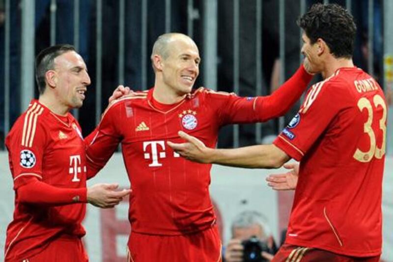 epa03143528 Bayern Munich's Mario Gomez (R) celebrates with his teammates Franck Ribery (L) and Arjen Robben (C) after scoring the 6-0 lead during the UEFA Champions League round of 16, second leg soccer match between FC Bayern Munich and FC Basel in Munich, Germany, 13 March 2012. Munich won 7-1 on aggregate.  EPA/TOBIAS HASE