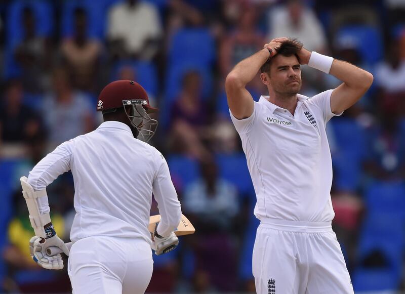 English fast bowler James Anderson reacts after a close call against batsman Denesh Ramdin (L) after earlier equaling the highest English wicket taker record with 383 on day five of the first cricket Test match between West Indies and England at the Sir Vivian Richards Stadium in St John's, Antigua on April 17, 2015.           AFP PHOTO/ MARK RALSTON (Photo by MARK RALSTON / AFP)