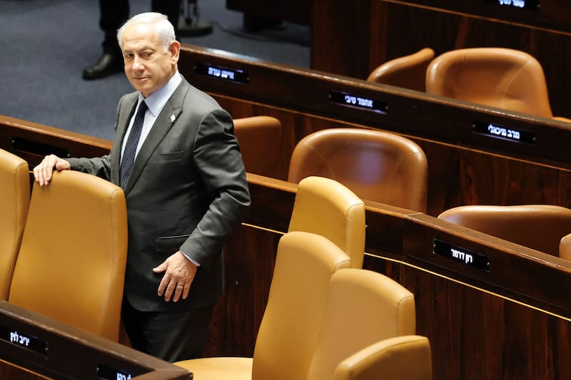 Prime Minister Benjamin Netanyahu stands on the floor of the Knesset, the country's parliament in Jerusalem. AFP