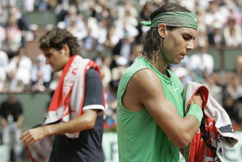 The chances of Roger Federer, left, ending Rafael Nadal's remarkable run at Roland Garros remain slim.