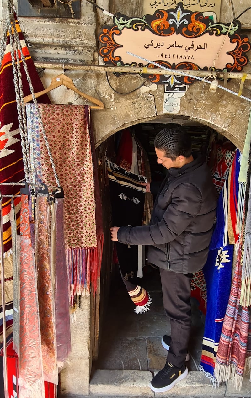 Samer Derki’s 50-year-old store showcases several brocade fabrics and rugs.