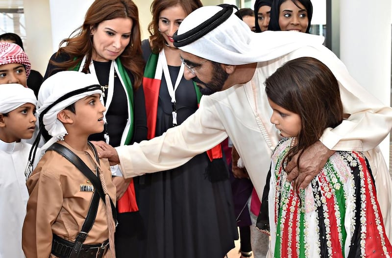 Sheikh Mohammed bin Rashid talks to children at the inauguration of Al Jalila Child Culture Centre in Dubai, in December 2014. Wam