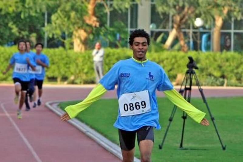 DUBAI - 21JAN2012 - Mohammed Mustafa Keema under-17 of Al Thuraya School finishing first in 1500meters in the Inter-School Athletics Championships yesterday at Dubai Police Club. Ravindranath K / The National