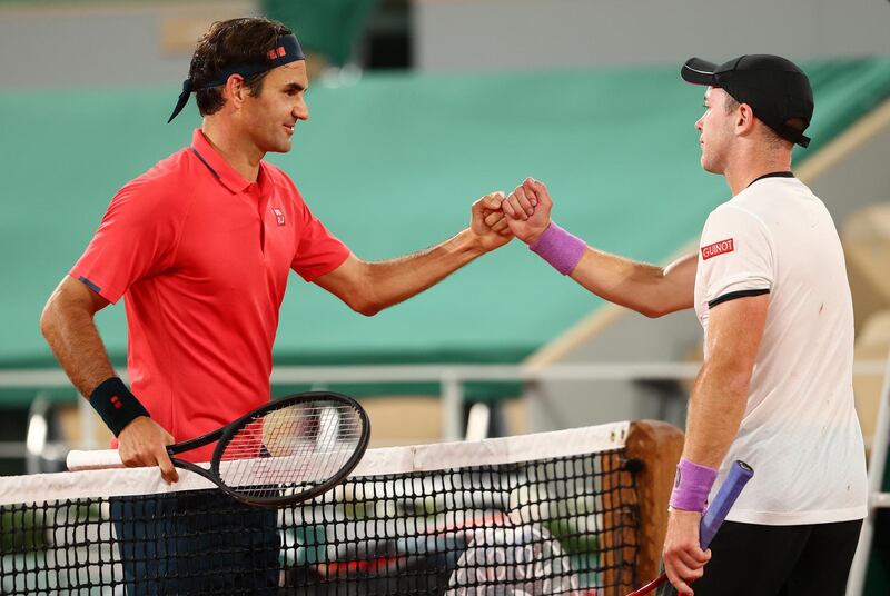 Swiss star Roger Federer shakes hands with Dominik Koepfer after winning their match. Getty
