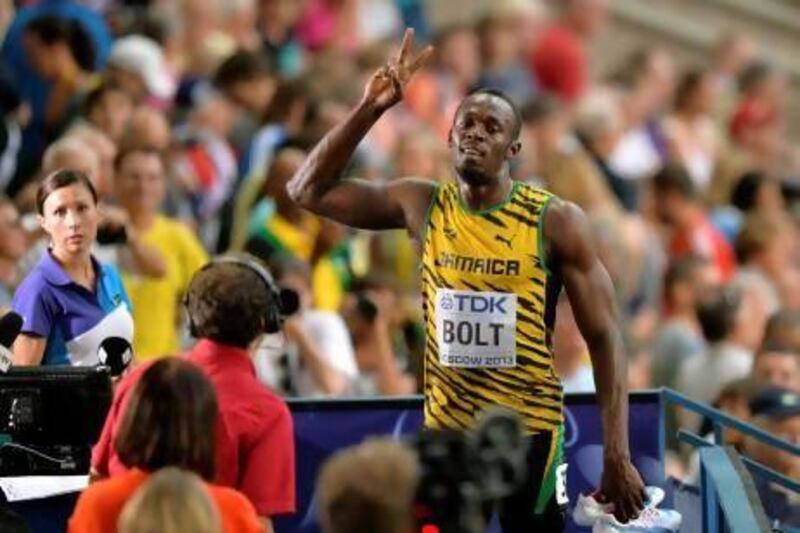 Jamaica's Usain Bolt gestures after competing in a men's 100-metre heat at the World Championships in Luzhniki Stadium at Moscow.