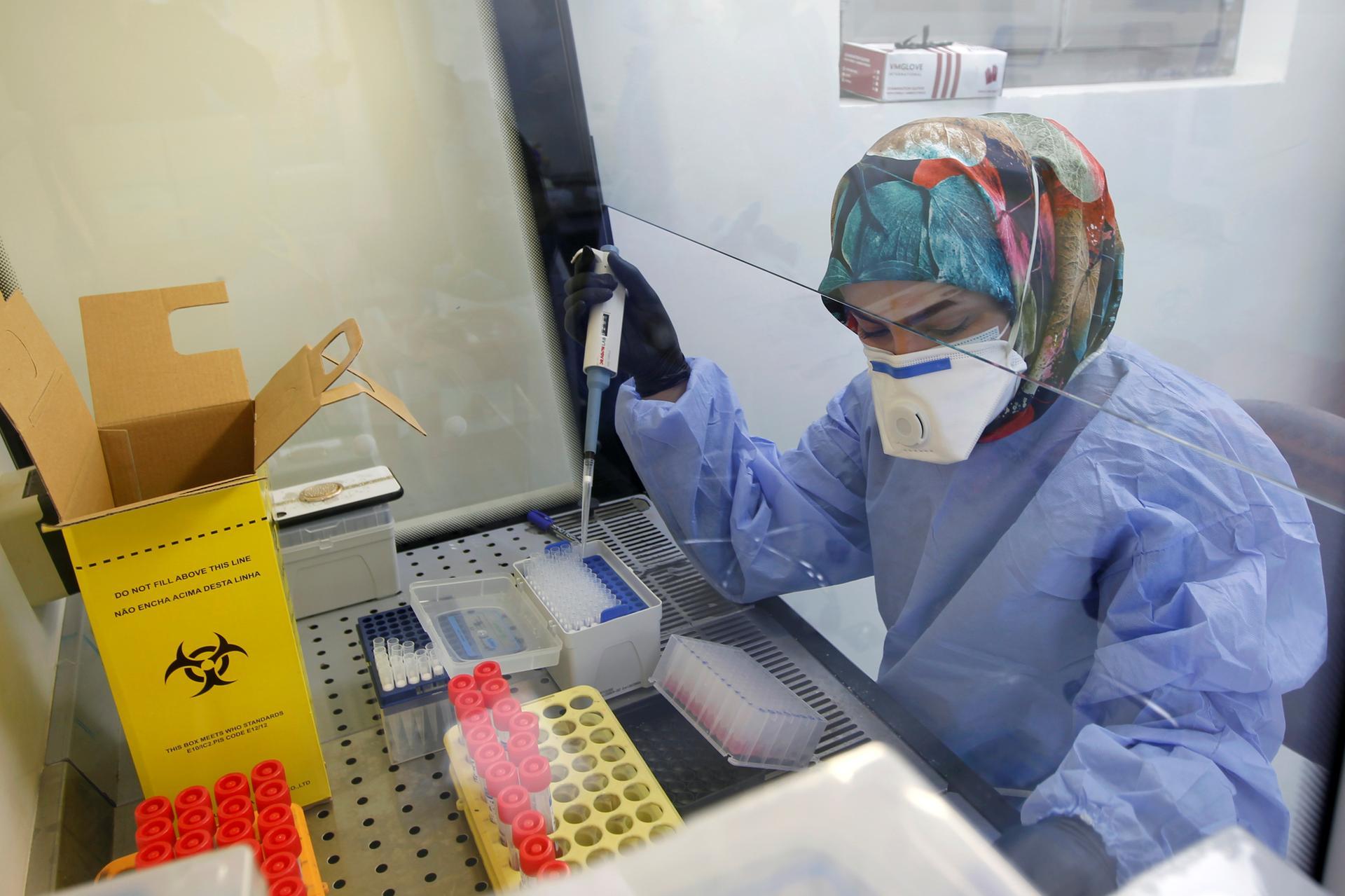 A medical team member works on blood samples to be tested for Covid-19 at a medical centre in a hospital in the holy city of Najaf, Iraq on February 15, 2021. Reuters