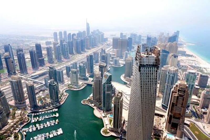 The Infinity Tower (right foreground) is seen from the Princess Tower in Dubai, United Arab Emirates, on Wednesday, Sept. 12, 2012.  Photographer: Duncan Chard / Bloomberg *** Local Caption ***  1092391.jpg