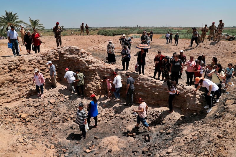 Iraqi Christians survey the archaeological site of Kokheh Church south of Baghdad, Iraq. AP Photo