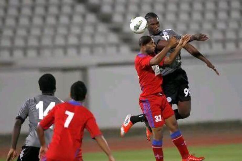 Makhete Diop, right, the Al Shaab forward, and his teammates, who beat Al Dhafra, in red, on Friday, will be in action again on Tuesday in the Etisalat Cup, where they face Dubai. Mike Young / The National