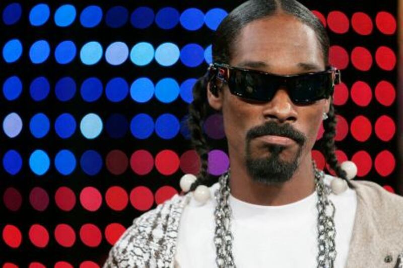 **FILE** Hip hop artist Snoop Dogg appears on stage during MTV's 'Total Request Live' show at the MTV Times Square Studios, in this Nov. 14, 2006, file photo in New York. Snoop Dogg pleaded not guilty Wednesday, Jan. 24, 2006 to a charge of possessing a deadly weapon, a collapsible police baton found in his luggage at an airport.  (AP Photo/Jeff Christensen, file)