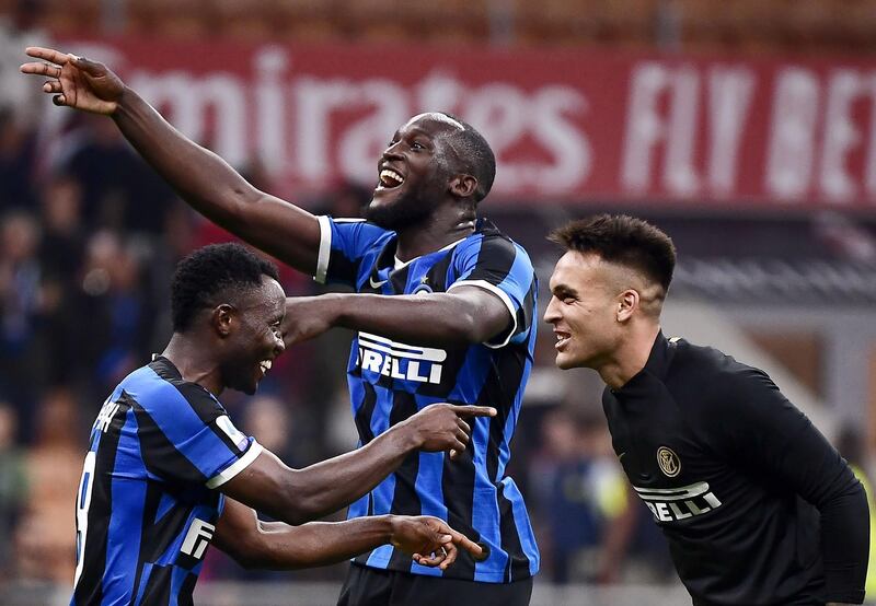 Inter Milan players celebrate at the final whistle. AFP