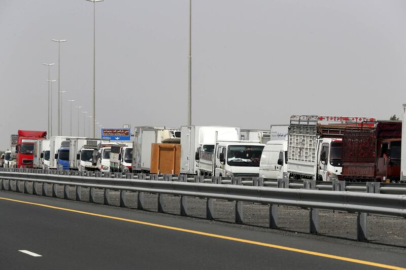DUBAI, UNITED ARAB EMIRATES , June 2 – 2020 :- Traffic jam at the Dubai border going towards Abu Dhabi on Sheikh Zayed road in Dubai. Abu Dhabi Police checking the movement permits at the police checkpoint on the Dubai – Abu Dhabi border on Sheikh Zayed road in Dubai. Abu Dhabi impose one week ban starting from Tuesday on travel on entering and leaving the emirate to reduce the spread of Covid-19  and ensure its huge testing drive works. (Pawan Singh / The National) For News/Online 