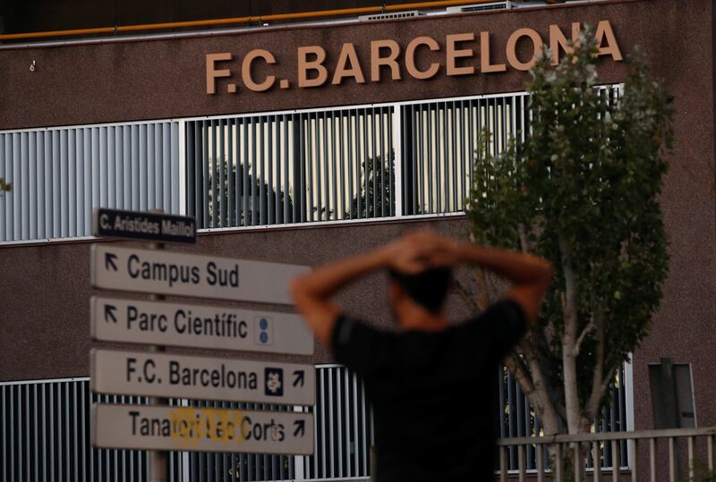 Barcelona's supporters gather outside the team headquarters.