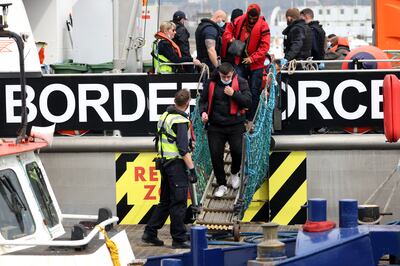 Migrants arrive at Dover Marina after being picked up by the border force. Getty Images