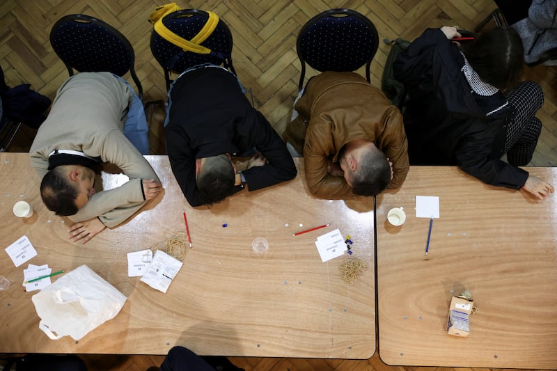 Members of the counting staff rest at Lindley Hall in Westminster. Reuters