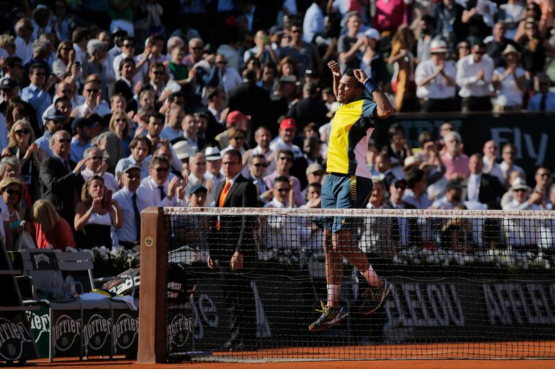 France's Jo-Wilfried Tsonga celebrates defeating Switzerland's Roger Federer in three sets 7-5, 6-3, 6-3, in their quarterfinal match at the French Open tennis tournament, at Roland Garros stadium in Paris, Tuesday June 4, 2013. (AP Photo/Christophe Ena) *** Local Caption ***  APTOPIX France Tennis French Open.JPEG-0c174.jpg