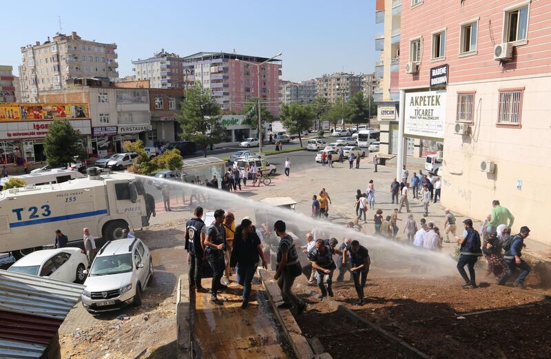 Police in Diyarbakir use a water cannon to disperse pro-Kurdish demonstrators. Reuters