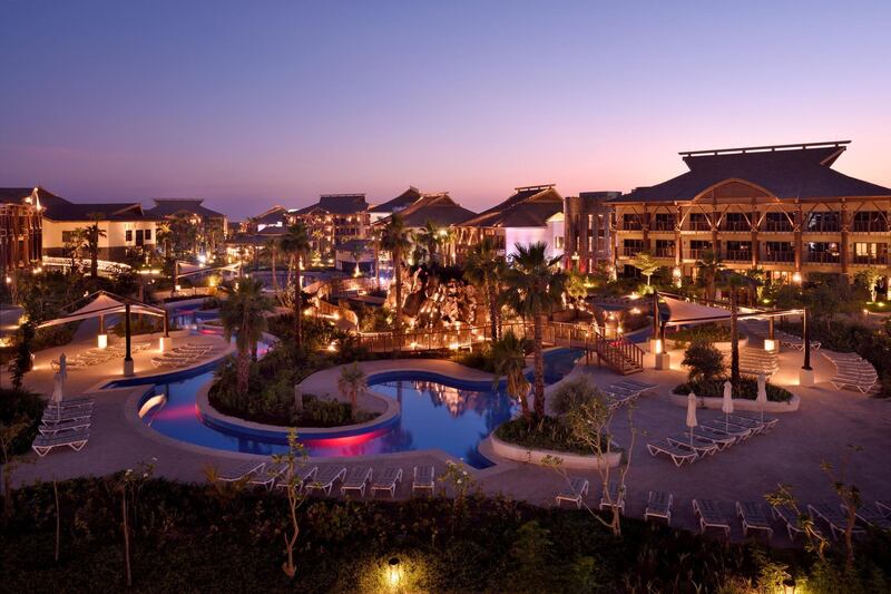 Lapita Hotel at Dubai Parks & Resorts at night. Autograph Collection