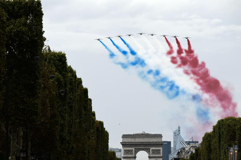The French national air display team Patrouille de France perform over Arc de triomphe monument. AFP