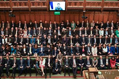 MPs listen to President Volodymyr Zelenskyy speaking to them by video link in March last year. AFP