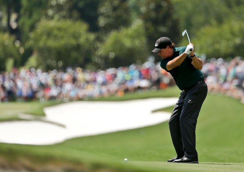 Phil Mickelson hits from the fairway on the first hole during the first round of the PGA Championship golf tournament at the Quail Hollow Club Thursday, August 10, 2017, in Charlotte. Chuck Burton / AP Photo