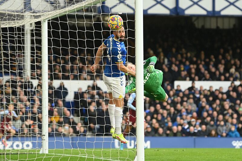 Jordan Pickford and Andros Townsend of Everton fail to stop a shot from Emiliano Buendia of Aston Villa. Getty