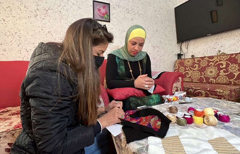 Farah Ajlouni, founder of Gioia footwear, sits with Ms Alayan.