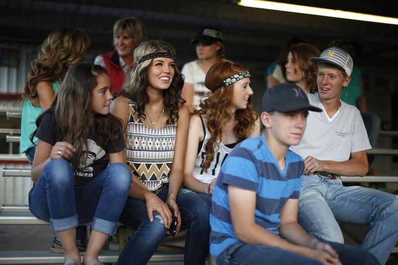 Teenagers watch the rodeo in Truth or Consequences, New Mexico. Many agree that Spaceport America should inject new energy into the town. Lucy Nicholson / Reuters